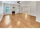 Spacious living room featuring hardwood floors, a fireplace, and ample natural light at 1326 Crown Ridge Dr, Fort Mill, SC 29708