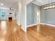 Bright living room with hardwood floors, fireplace, and modern lighting fixtures at 1326 Crown Ridge Dr, Fort Mill, SC 29708