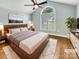 Stylishly staged main bedroom with vaulted ceiling, neutral tones, and a large window for natural light at 1326 Crown Ridge Dr, Fort Mill, SC 29708