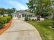 Inviting single-story home with a screened porch and landscaped yard at 1326 Crown Ridge Dr, Fort Mill, SC 29708