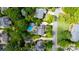Beautiful aerial view of the property showcasing the pool, landscaping, and neighborhood at 1522 12Th Fairway Nw Dr, Concord, NC 28027