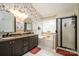 A renovated bathroom features a separate tub and shower plus double vanity sinks at 1522 12Th Fairway Nw Dr, Concord, NC 28027