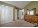A secondary bedroom features a closet and access to another room at 1522 12Th Fairway Nw Dr, Concord, NC 28027