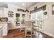 Cozy breakfast nook with a view to the patio, white trim, and a modern light fixture overhead at 1522 12Th Fairway Nw Dr, Concord, NC 28027