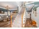Spacious foyer with hardwood floors, a staircase, and wainscoting detail offers a grand entrance at 1522 12Th Fairway Nw Dr, Concord, NC 28027