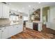 Spacious kitchen with white cabinets, granite countertops, stainless steel appliances and open view to living area at 1522 12Th Fairway Nw Dr, Concord, NC 28027