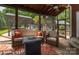 Relaxing screened-in patio with comfortable seating, fire pit, and view of the backyard pool and cabana at 1522 12Th Fairway Nw Dr, Concord, NC 28027