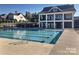 Stunning community pool with sundeck and clubhouse provides the perfect space to relax and socialize at 15515 Laverack Ln, Davidson, NC 28036