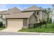 Rear exterior featuring a two-car garage and private yard space at 15515 Laverack Ln, Davidson, NC 28036