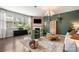 Comfortable living room featuring a fireplace, large windows, and stylish decor at 15515 Laverack Ln, Davidson, NC 28036