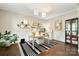 Stylish home office with hardwood floors, wainscotting, and modern decor at 15515 Laverack Ln, Davidson, NC 28036
