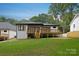 Lovely backyard with a wooden deck, perfect for outdoor gatherings at 1626 Burtonwood Cir, Charlotte, NC 28212