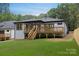 Home's expansive backyard and private wooden deck, ideal for entertaining at 1626 Burtonwood Cir, Charlotte, NC 28212