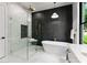 Stylish bathroom boasts a glass shower with a built-in seat and a luxurious soaking tub at 1626 Burtonwood Cir, Charlotte, NC 28212
