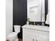 Stylish powder room with modern black and gold accents at 1626 Burtonwood Cir, Charlotte, NC 28212