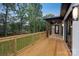 Wooden deck with wood railings and view of the backyard at 1626 Burtonwood Cir, Charlotte, NC 28212