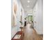 Bright hallway with hardwood floors and modern artwork on the wall at 1626 Burtonwood Cir, Charlotte, NC 28212