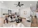 Open-concept living room featuring a kitchen island and stylish furniture at 1626 Burtonwood Cir, Charlotte, NC 28212