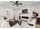 Bright living room with stylish furniture and a cozy fireplace feature at 1626 Burtonwood Cir, Charlotte, NC 28212
