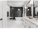 Modern main bathroom featuring double vanity, separate shower and bath tub with black accent wall at 1626 Burtonwood Cir, Charlotte, NC 28212