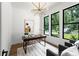 Bright home office featuring modern lighting, large windows, and sleek desk at 1626 Burtonwood Cir, Charlotte, NC 28212
