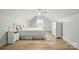 Bright bedroom with white interior, hardwood floors, large window, and a ceiling fan for natural light at 167 Logan Crossing Dr, Davidson, NC 28036