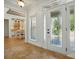Bright entryway featuring a decorative glass front door and tiled flooring leading into the home's living spaces at 167 Logan Crossing Dr, Davidson, NC 28036