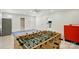 Spacious game room features a foosball table, recessed lights, and a view of the adjacent kitchen at 167 Logan Crossing Dr, Davidson, NC 28036