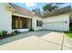 This single Gathering home features an attached garage, convenient driveway, and inviting front porch for welcoming guests at 167 Logan Crossing Dr, Davidson, NC 28036