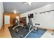 This spacious home gym has a textured ceiling, exposed ductwork, and multiple machines at 167 Logan Crossing Dr, Davidson, NC 28036