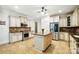 Bright kitchen features ample counter space, stainless appliances, and a center island perfect for meal preparation and dining at 167 Logan Crossing Dr, Davidson, NC 28036