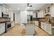 Well-equipped kitchen featuring stainless steel appliances, custom cabinetry, granite countertops, and a functional center island at 167 Logan Crossing Dr, Davidson, NC 28036