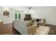 Comfortable living room area with hardwood floors, plush seating, a TV, and a glass door to the yard at 167 Logan Crossing Dr, Davidson, NC 28036