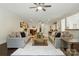 Spacious open-concept living room with plush seating, hardwood floors, and a decorative area rug at 167 Logan Crossing Dr, Davidson, NC 28036