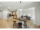 Open-concept space with kitchen island and bar stool seating that opens into the living room and dining area at 167 Logan Crossing Dr, Davidson, NC 28036
