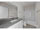 Bathroom featuring a granite vanity, white cabinets, and combined shower-tub at 1723 Rhyneland Cir, Gastonia, NC 28054
