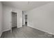 Spacious bedroom with a walk-in closet, neutral tones, and contemporary flooring at 1723 Rhyneland Cir, Gastonia, NC 28054