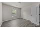 Serene bedroom with natural light, modern flooring, and a minimalist aesthetic at 1723 Rhyneland Cir, Gastonia, NC 28054
