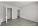 Open bedroom with a walk-in closet, neutral tones, and contemporary flooring at 1723 Rhyneland Cir, Gastonia, NC 28054