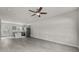 Modern living space with an open-concept kitchen, island, and stainless steel refrigerator at 1723 Rhyneland Cir, Gastonia, NC 28054