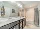 Clean bathroom with a double vanity, shower-tub combo, and neutral color palette at 1812 Sutter Creek Dr, Waxhaw, NC 28173