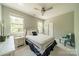 Bright bedroom with ample natural light, a ceiling fan, and neutral decor for a calming retreat at 1812 Sutter Creek Dr, Waxhaw, NC 28173