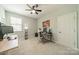 Inviting bedroom furnished with a desk, computer setup, and a comfortable chair for studying at 1812 Sutter Creek Dr, Waxhaw, NC 28173