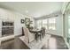 Light-filled dining room showcases an elegant table set, sophisticated decor, and views of the backyard at 1812 Sutter Creek Dr, Waxhaw, NC 28173