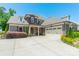 Beautiful home featuring a stone facade, gray siding, a two-car garage, and a well-manicured front yard at 1812 Sutter Creek Dr, Waxhaw, NC 28173