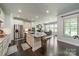 Open-concept kitchen flows seamlessly into the dining area, perfect for modern living at 1812 Sutter Creek Dr, Waxhaw, NC 28173