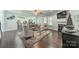 Comfortable living room featuring a fireplace and seamless flow into the modern kitchen at 1812 Sutter Creek Dr, Waxhaw, NC 28173