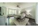 Spacious main bedroom boasts tray ceilings, large windows, a seating area, and stylish decor at 1812 Sutter Creek Dr, Waxhaw, NC 28173