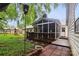 Spacious backyard includes a deck, screened in porch, patio, and play area at 1821 Bonnie Ln, Charlotte, NC 28213
