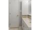 Simple bathroom featuring a white vanity, toilet, mirror, cabinet, and neutral color scheme at 1821 Bonnie Ln, Charlotte, NC 28213